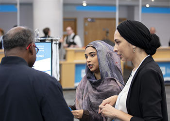 People talking at a conference