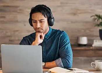 Man watching something on his laptop