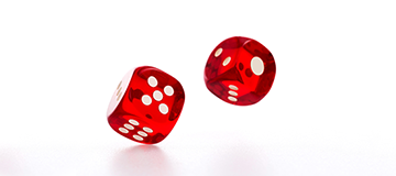 Two red dice tumble across a white background